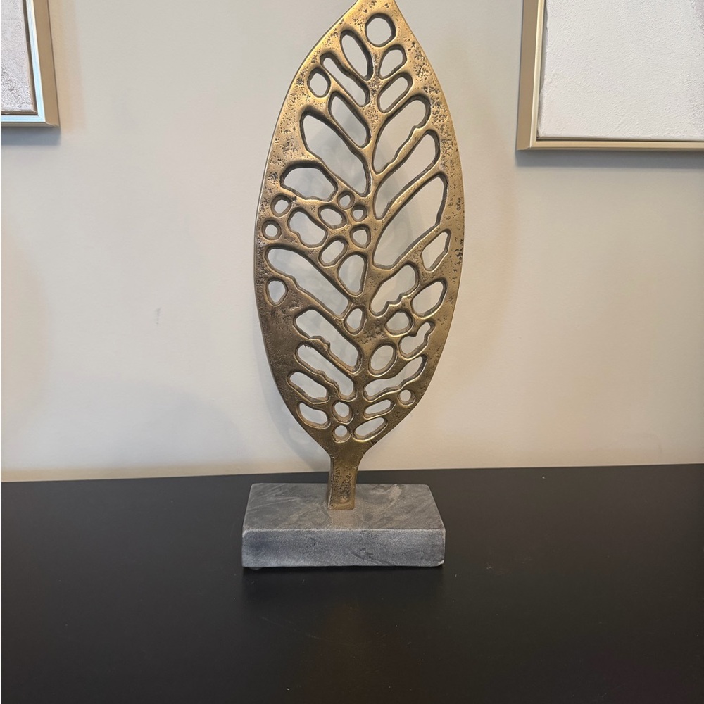 Gold Leaf Sculpture on Gray Base
